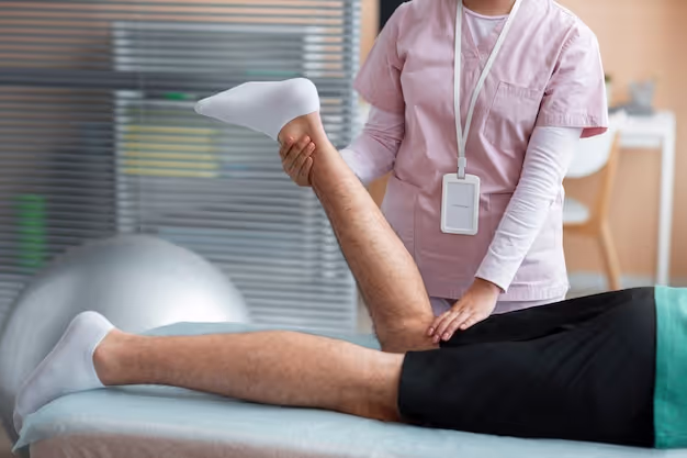 Doctor helping patient during rehabilitation